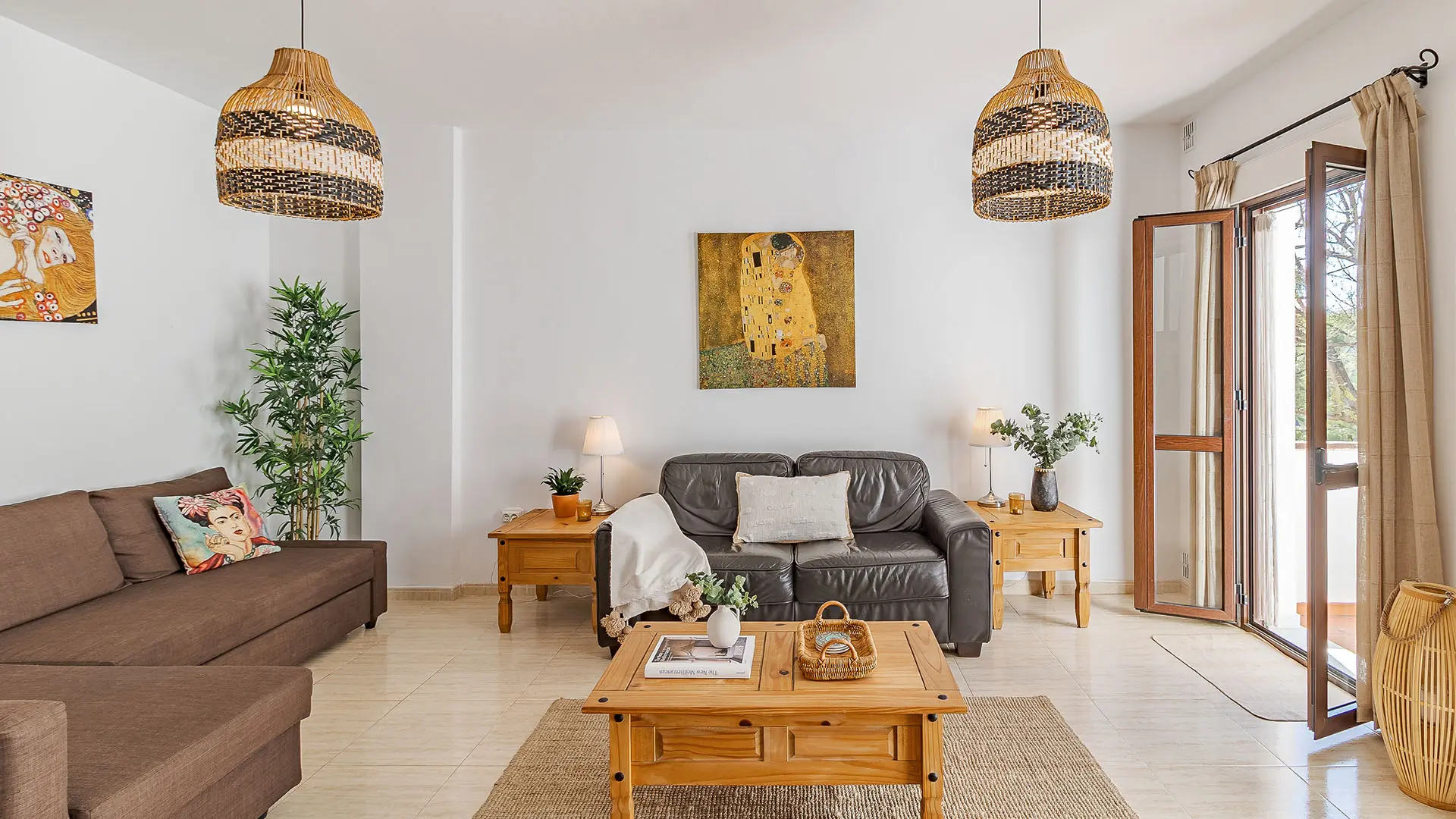 Bright living room with sofas and rattan lamps – apartment for sale on Calle las Huertas 12, Frigiliana
